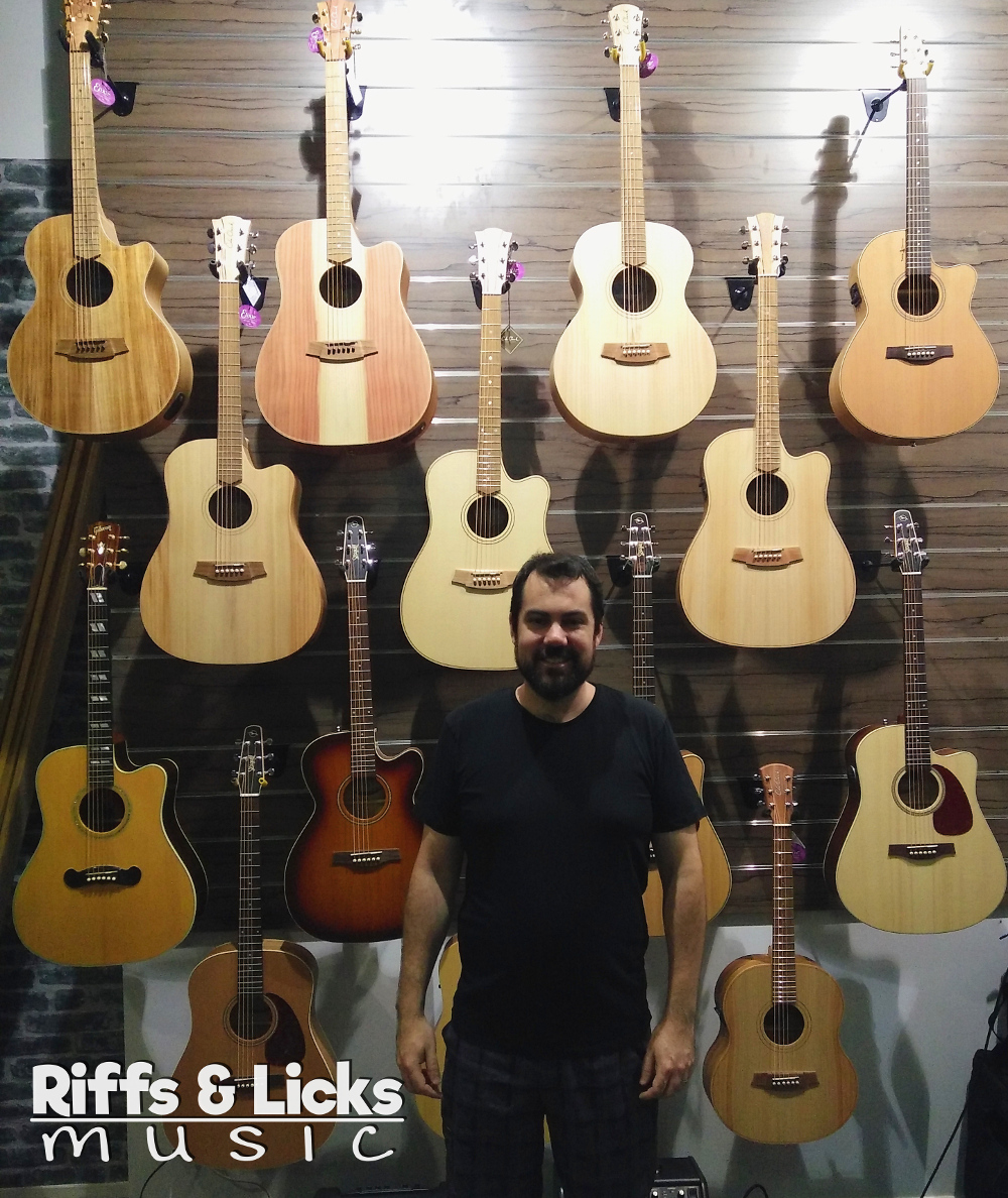 Ryan in front of Cole Clark & Seagull guitars